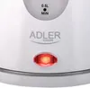 Close-up of a white electric kettle showing the brand logo, water level indicator, and an illuminated power indicator light. Voir les images du produit