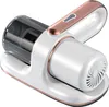 A white and rose gold handheld vacuum cleaner with a transparent dustbin, resting on its charging base. Produktbild-Vorschau