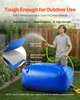 A man is spraying water into a large blue water storage bag in a backyard setting. Náhled obrázku produktu