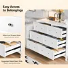 A white dresser with several drawers open, showcasing its interior and hardware. Text overlays highlight features. Voir les images du produit