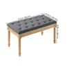 A grey upholstered bench with wooden legs, shown from a diagonal angle against a white background. Dimensions are indicated with text overlays. Podgląd zdjęcia produktu