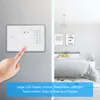 A hand is shown interacting with a digital thermostat mounted on a wall, with a bedroom scene in the background. Podgląd zdjęcia produktu