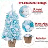 A decorated mini Christmas tree with text overlays describing its features. Náhled obrázku produktu
