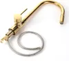 A gold kitchen faucet with a pull-out hose, shown against a white background. Produktbild-Vorschau