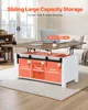 A lift-top coffee table with storage compartments is shown in a living room setting. Voir les images du produit