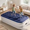Two children are jumping on an inflatable mattress in a living room. Anteprima dell’immagine prodotto