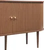 A close-up view of a wooden sideboard with two doors and gold handles, set against a white background. Náhled obrázku produktu