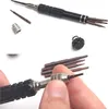 A set of precision screwdrivers and their components are displayed against a white background, with a hand demonstrating how to insert a screwdriver bit. Produktbild-Vorschau
