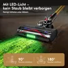 A close-up of a cordless vacuum cleaner head on a wooden floor, with green LED lights illuminating dust and debris. The image also shows diagrams illustrating the vacuum's 90 and 180-degree flexibility. Produktbild-Vorschau