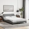 A bedroom scene with a bed, nightstands, and a picture on the wall. Produktbild-Vorschau