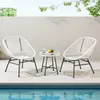 Two white chairs and a small glass-topped table are set up on a patio next to a swimming pool. Voir les images du produit