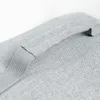 A close-up of a gray fabric handle on a bag. Anteprima dell’immagine prodotto
