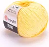 A ball of yellow yarn with a label. Náhľad obrázku produktu