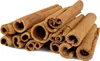 A pile of dried cinnamon sticks on a white background. Produktbild-Vorschau