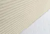 A close-up view of a beige corduroy fabric and a white quilted mattress. Voir les images du produit
