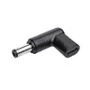 A black adapter with silver metal connectors on a white background. Produktbild-Vorschau