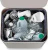 A top-down view of a recycling bin filled with various recyclable materials, including plastic bottles, aluminum cans, and crushed plastic containers. Podgląd zdjęcia produktu