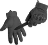 A pair of black tactical gloves with a knife being inserted into one of them. Produktbild-Vorschau