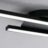 A close-up shot of a modern black LED ceiling light fixture with two light bars. Produktbild-Vorschau