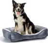 A dog sitting in a dog bed. Produktbild-Vorschau