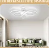 A modern living room with a green sofa and a white LED ceiling light. Podgląd zdjęcia produktu