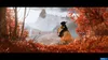 A person on horseback rides through a forest with red autumn leaves, with a distant castle on a misty mountain. Produktbild-Vorschau