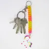 A set of keys with a colorful unicorn keychain and a coiled lanyard. Produktbild-Vorschau