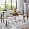 A dining set for two people is placed in a room with a large window overlooking greenery. Produktbild-Vorschau