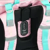 A close-up view of the back of a pink backpack, focusing on the adjustable strap system and branding. Voir les images du produit