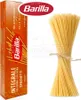 A box of Barilla whole wheat spaghetti and a bundle of uncooked spaghetti. Produktbild-Vorschau