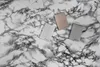 Three external hard drives are arranged on a marble-like surface. Anteprima dell’immagine prodotto