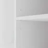 A close-up view of a white shelf inside a cabinet, showing mounting holes and a shelf support. Produktbild-Vorschau