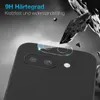 A close-up of a smartphone camera lens protector being applied to a black smartphone. The background is dark and dramatic, with debris flying around. Produktbild-Vorschau