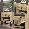 A collage of images showing a wooden nightstand with a black metal frame, placed in a bedroom setting. Produktbild-Vorschau