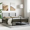 A bedroom scene with a black metal bed frame as the main focus. Produktbild-Vorschau
