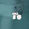 A close-up view of a teal backpack's zipper pull and drawstring. Anteprima dell’immagine prodotto