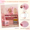 A pink children's vanity set with a chair, featuring a mirror with lights, storage drawers, and decorative elements. The image also includes close-ups of safety features and materials. Voir les images du produit