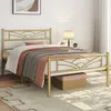 A gold metal bed frame with a cloud pattern headboard is shown in a bedroom setting. Produktbild-Vorschau