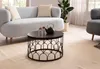 A living room scene with a sofa, coffee table, and armchair. Produktbild-Vorschau