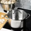 A stainless steel pot with a glass lid sits on a black stovetop, next to a cutting board with sliced mushrooms and a colander full of mushrooms in the background. Voir les images du produit