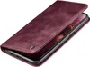 A burgundy flip case for a smartphone is shown from a diagonal angle, with the cover partially open. Produktbild-Vorschau
