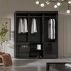 A modern bedroom or dressing room with a large black wardrobe. Náhled obrázku produktu