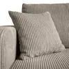 A close-up view of a corduroy sofa with pillows. Produktbild-Vorschau