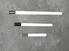 Three LED light bars of varying lengths are displayed horizontally against a textured gray background. Produktbild-Vorschau