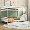 A white wooden bunk bed with two drawers underneath, set up in a room with green walls and a patterned rug. Náhled obrázku produktu
