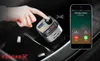A hand is shown pressing a button on a car FM transmitter, with a smartphone displaying an incoming call next to it. Podgląd zdjęcia produktu