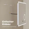 A mirror with integrated LED lighting is shown mounted on a wall, with wires and mounting hardware visible. Náhľad obrázku produktu