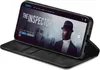 A smartphone in a black flip case, displaying a movie poster on its screen. Produktbild-Vorschau