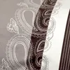 A close-up view of a fabric with a paisley pattern. Produktbild-Vorschau