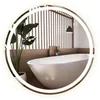 A modern bathroom with a freestanding bathtub, a plant, and a slatted wooden wall, reflected in a round, LED-lit mirror. Produktbild-Vorschau